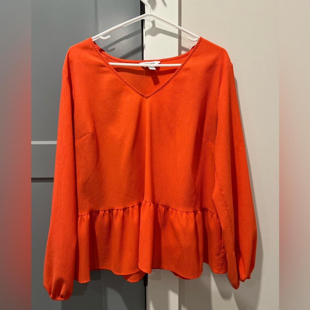 Orange ruffled blouse. Excellent used condition!